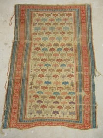 Antique scatter rug (Kuba Shirvan ?) with repetitive floral pattern, worn, as found, carpet is 54"