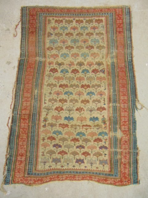 Antique scatter rug (Kuba Shirvan ?) with repetitive floral pattern, worn, as found, carpet is 54" (1 of 4)