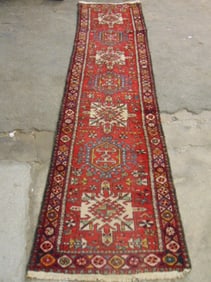 Persian runner, in red, rug is 9'10" long, 30" wide