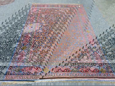 Persian carpet, in blue, 9' by 6'3" with center medallion
