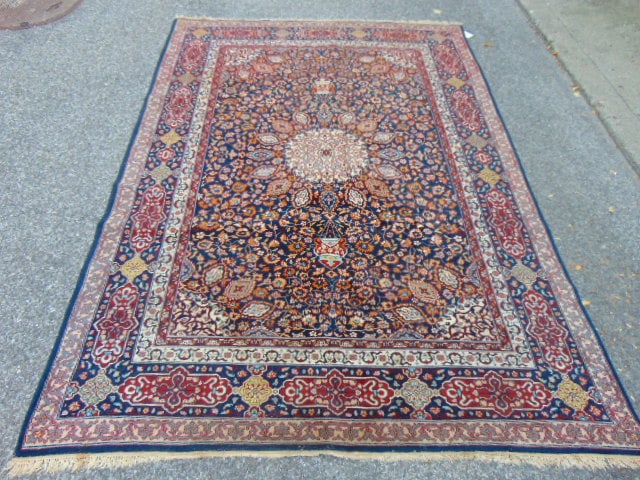 Persian carpet, in blue, 9' by 6'3" with center medallion: Persian carpet, in blue, 9' by 6'3" with center medallion