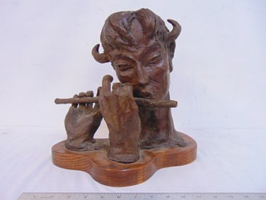 Bronze sculpture, Pan playing flute, signed Jack..illegible, on wood base, base is 13.25" by 9"
