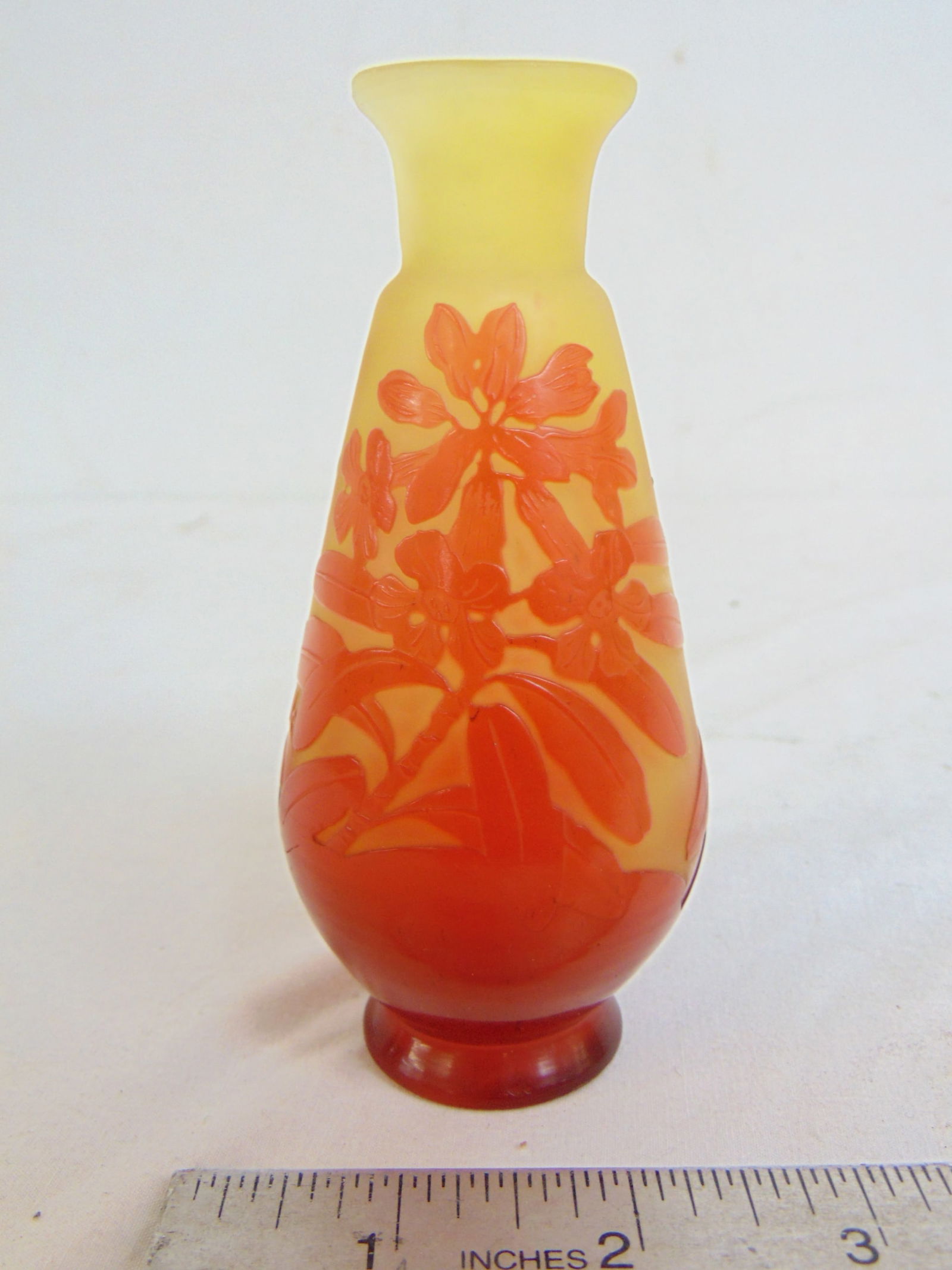 Small Galle art glass cameo vase in orange over yellow, floral designs, in good condition, height is (1 of 3)