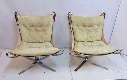 Pair mid Century "Falcon" chairs, steel chrome bases with leather, leather covering,
