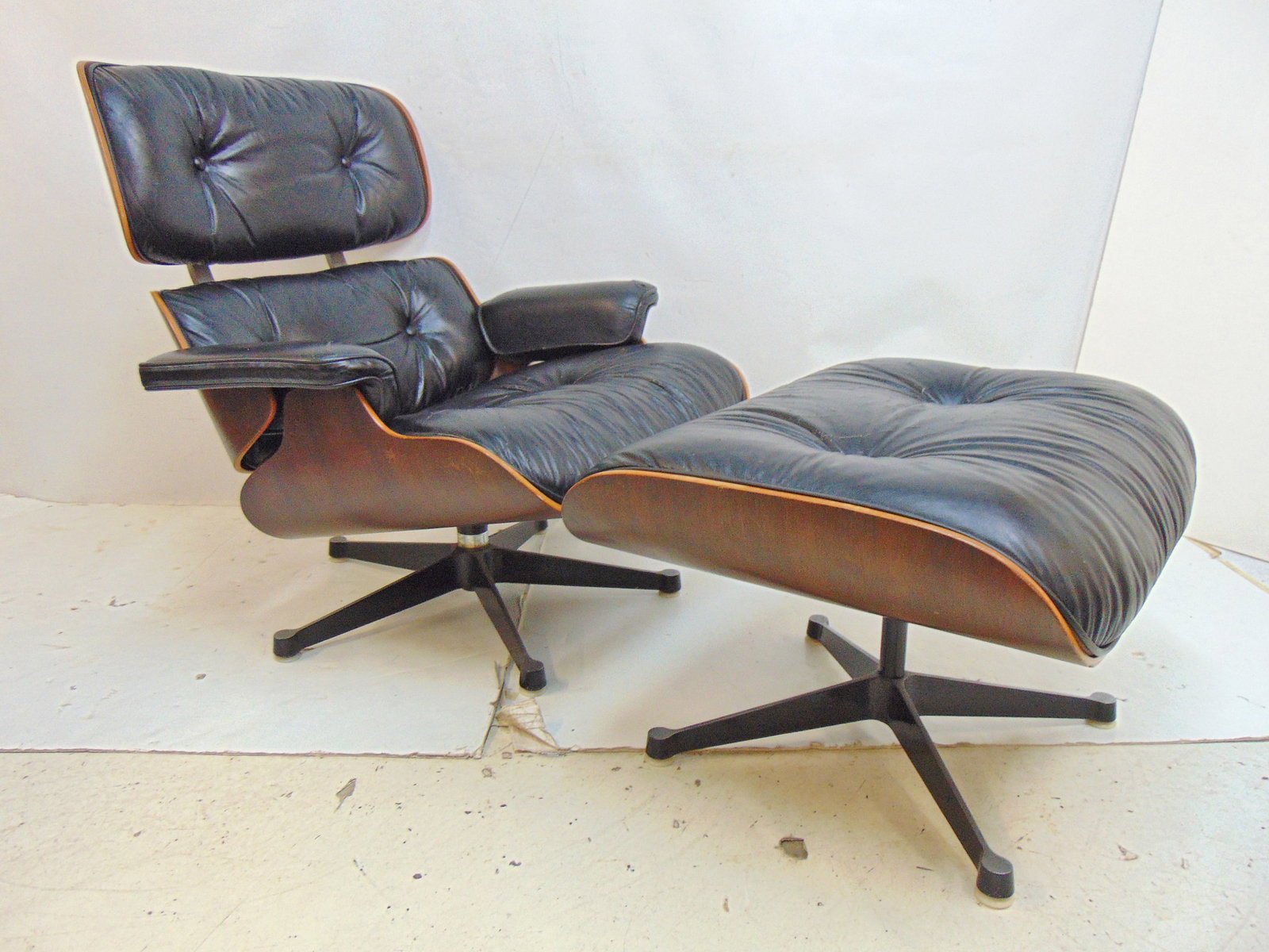 Black leather Eames chair & ottoman, normal wear on chair, leather, no tears.: Black leather Eames chair & ottoman, normal wear on chair, leather, no tears.