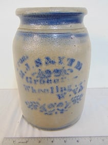 Small stoneware crock, Wheeling WV druggist crock, height is 9.75", good condition.