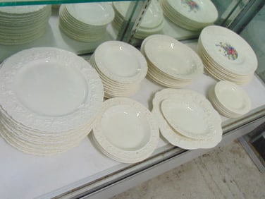 Wedgwood Embossed Queensware plates, bowls, some with floral design, overall good condition