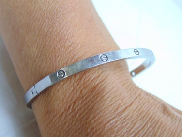 Jewelry. 18kt CARTIER designer Love Bracelet, 14.20 grams, hallmark Cartier 19 DJF726 Au750, 2 1/2"