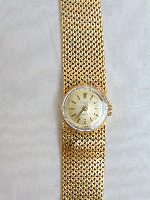 Jewelry. Vintage 18kt Gold Tiffany & Co. Universal Geneve ladies wristwatch, 33.20 grams, just over (1 of 7)