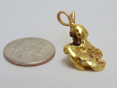 Jewelry. Gold nugget pendant, 13.30 grams, nugget tested 18kt and bail tested for 14kt