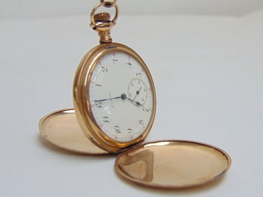 Gold ELGIN C.W.C. Co. pocket watch, # 1894420 w/ GF watch chain & clip, decorated case.