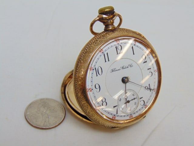 ILLINOIS WATCH CO. GOLD FILLED pocket watch, open face, decorated case, hallmark guaranteed 20: ILLINOIS WATCH CO. GOLD FILLED pocket watch, open face, decorated case, hallmark guaranteed 20 years, 6773813, 15 jewels, 146658, dial has some cracks, see photo