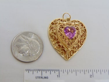 Jewelry. 14kt Gold heart pendant w/ pink stone, filigree work, 13.55 grams