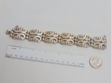 Jewelry. Mexican Sterling bracelet, 3.10 troy oz, 8" total length, 1" width, hallmark MWS 925