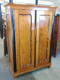 Antique Biedermeier wardrobe, double door, black trim, cabinet is 51.75" wide, 21.25" deep, height i