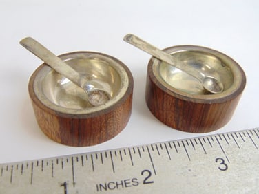 Pair William Spratling salts, wood exterior silver interior, with spoons