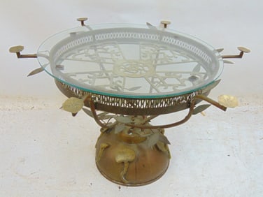 Unusual brass base glass top table from the Helena Rubinstein estate, table is 26.5" in diameter,