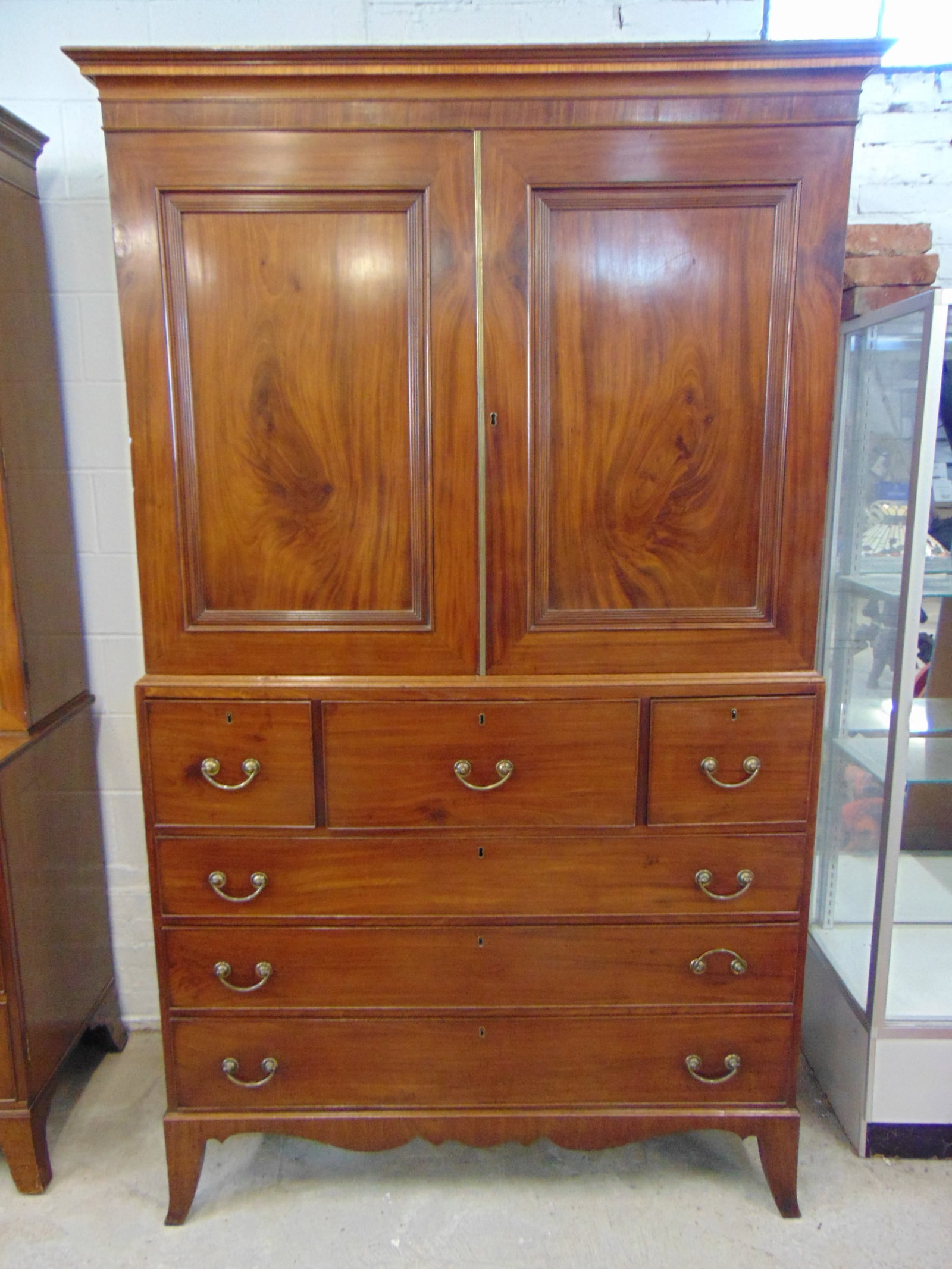Mahogany linen press, 3 over 3 base, top fitted with drawers, top center drawer in base has desk,: Mahogany linen press, 3 over 3 base, top fitted with drawers, top center drawer in base has desk, cabinet is 50" wide, 22" deep, height is 85.75"