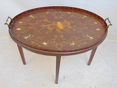 Small inlaid oval side tray table, inlaid with musical instruments, sea shells, 25" by 18"