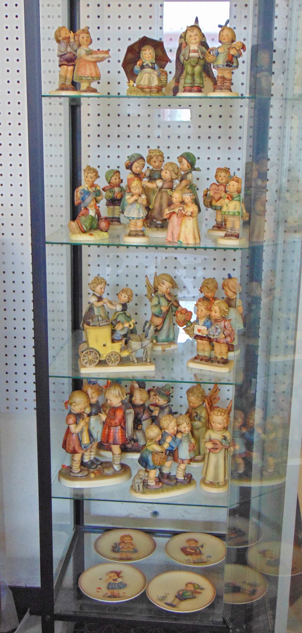 Large collection Hummel figurines, 28 pieces including 4 plates, and several oversized figurines. (1 of 7)