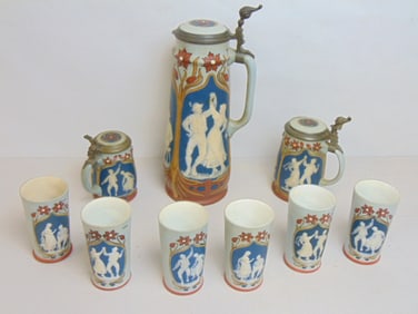 3 Mettlach steins & 6 cups, decorated with dancing figures, largest stein is 14.25" tall, 1/4 liter