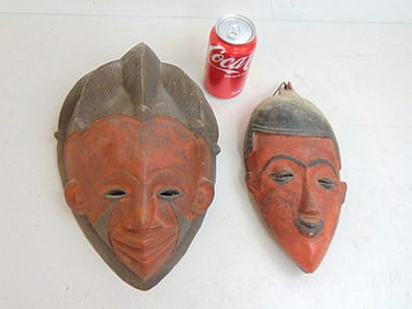 Two antique African Baule masks, red & black pigment, Ivory Coast, one has damages antler, 13 1/8"