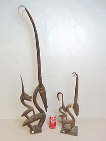 2 African antelope Chiwara carvings, one has repair, broken neck, 22" & 44" tall