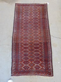 Persian carpet, in red, rug is 67" by 33.5"