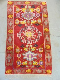 Wool scatter rug in red, carpet is 61" by 35"