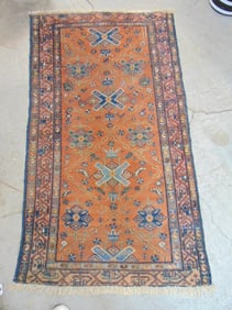 Persian carpet, brown reddish center, rug is 70" by 40"
