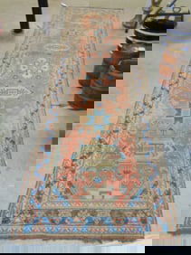 Persian runner, light red, blue border, carpet is 9'9" by 32"