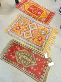 3 small wool scatter rugs in orange & red, largest one is 41" by 28.5"
