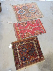 3 small scatter rugs in red, largest one is 34" by 31"