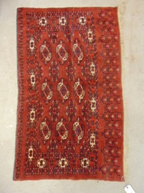 Small Bokhara carpet in red, rug is 54" by 33"