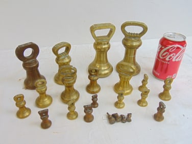 Lot small antique brass weights, two 4 pound weights, two 2 pound & assorted small weights.