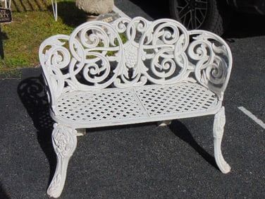 Cast iron garden bench, decorative design with curved grapevines & grape cluster in back, bench is