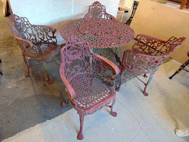 Garden set, cast iron table with 4 cast iron chairs, floral decorated, table is 39" in diameter, (1 of 5)