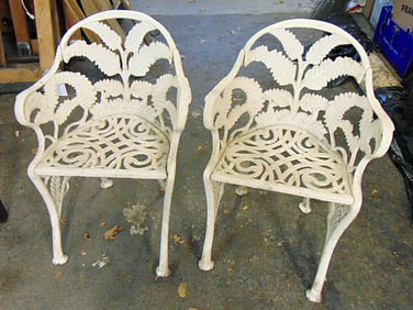 Pair Victorian cast iron fern decorated chairs, chairs are 23" by 13.5" deep (seat), height is 29.5"