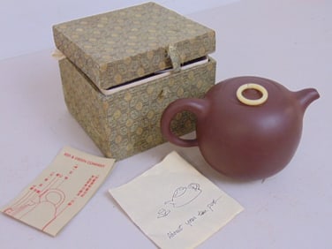 Chinese Clay teapot in original box, "Yi-Xing clay", box is 5.5" by 5", height is 4.5"