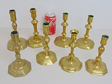 Lot 8 antique brass candlesticks, includes one pair & 6 single, between 6.5" & 7.5" tall.