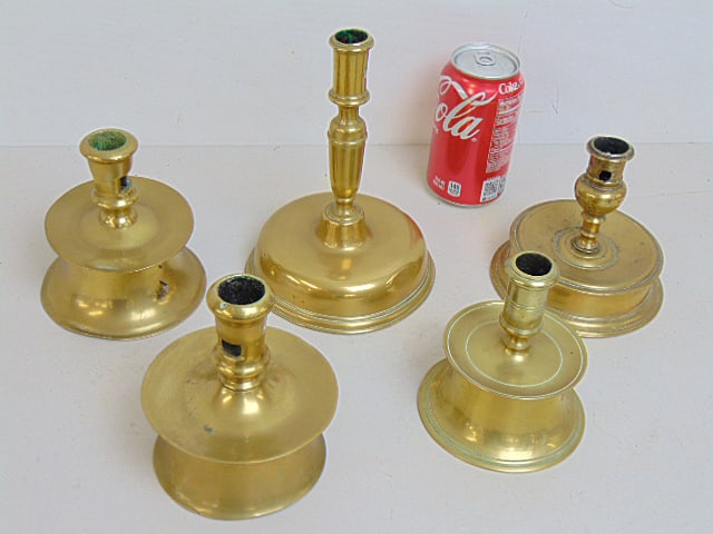 Lot of 5 antique brass candle holders, 4 with wide wax basin bases, highest stick is 7.75", widest (1 of 5)
