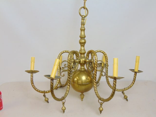 Brass chandelier, hanging fixture, 6 arms in spiral form, fixture is 29" in diameter, 25" tall (plus: Brass chandelier, hanging fixture, 6 arms in spiral form, fixture is 29" in diameter, 25" tall (plus chain), one cup is loose, arm with loose cup has slight separation.