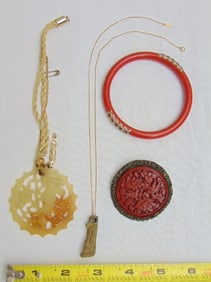 Jewelry. Asian lot: 14kt chain with stone figure, Egyptian? ; carved bird pendant russet jade;