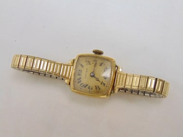 Jewelry. Vintage GRUEN ladies wrist watch 14kt yellow gold face, wristband is speidel stainless &