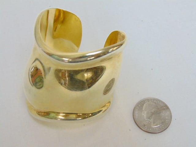 Jewelry. Tiffany & Co. Elsa Peretti bone cuff sterling silver, 925 Italy gold wash, 2.64: Jewelry. Tiffany & Co. Elsa Peretti bone cuff sterling silver, 925 Italy gold wash, 2.64 troy oz, 2" at widest part, some scratches, fully signed interior cuff. vintage sterling cuff.