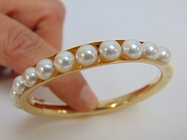 Jewelry. Gold & Pearl bangle bracelet, 14kt w/ 11 single set pearls each approx. 4mm, 17.50 grams, 2