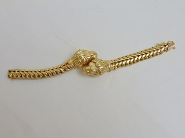 Jewelry. Gold 18kt double lion's head bracelet, 26.55 grams, hallmark 18kt, length 6 3/4" width of