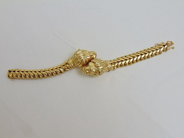 Jewelry. Gold 18kt double lion's head bracelet, 26.55 grams, hallmark 18kt, length 6 3/4" width of (1 of 5)