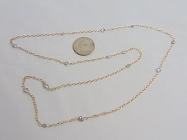 Jewelry. Diamond & Gold necklace 6.40 grams, round bezel set diamonds in between gold links, 15