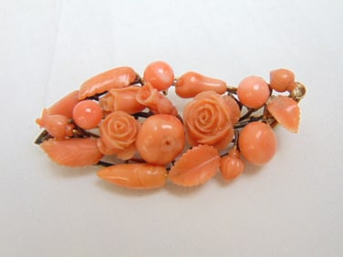 Jewelry. Antique carved coral brooch, pin 2 1/4" x 1 1/8" carved flowers & fruit